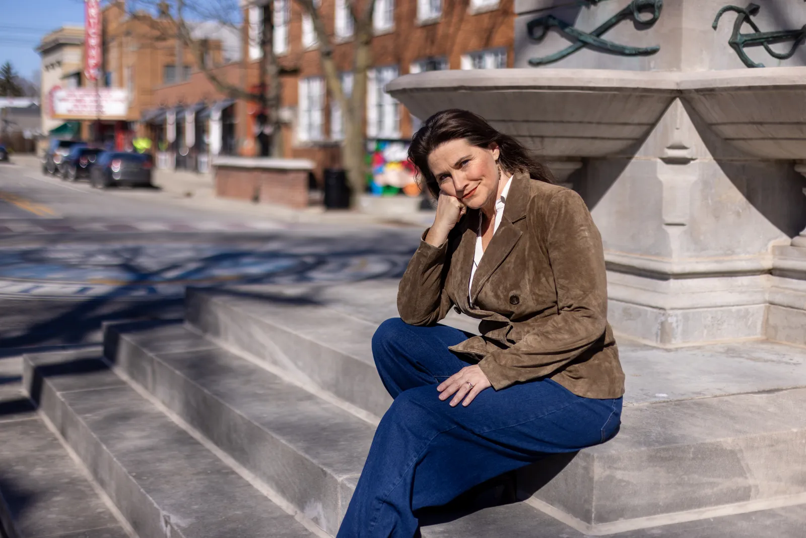 Sarah Brown sitting on courthouse steps